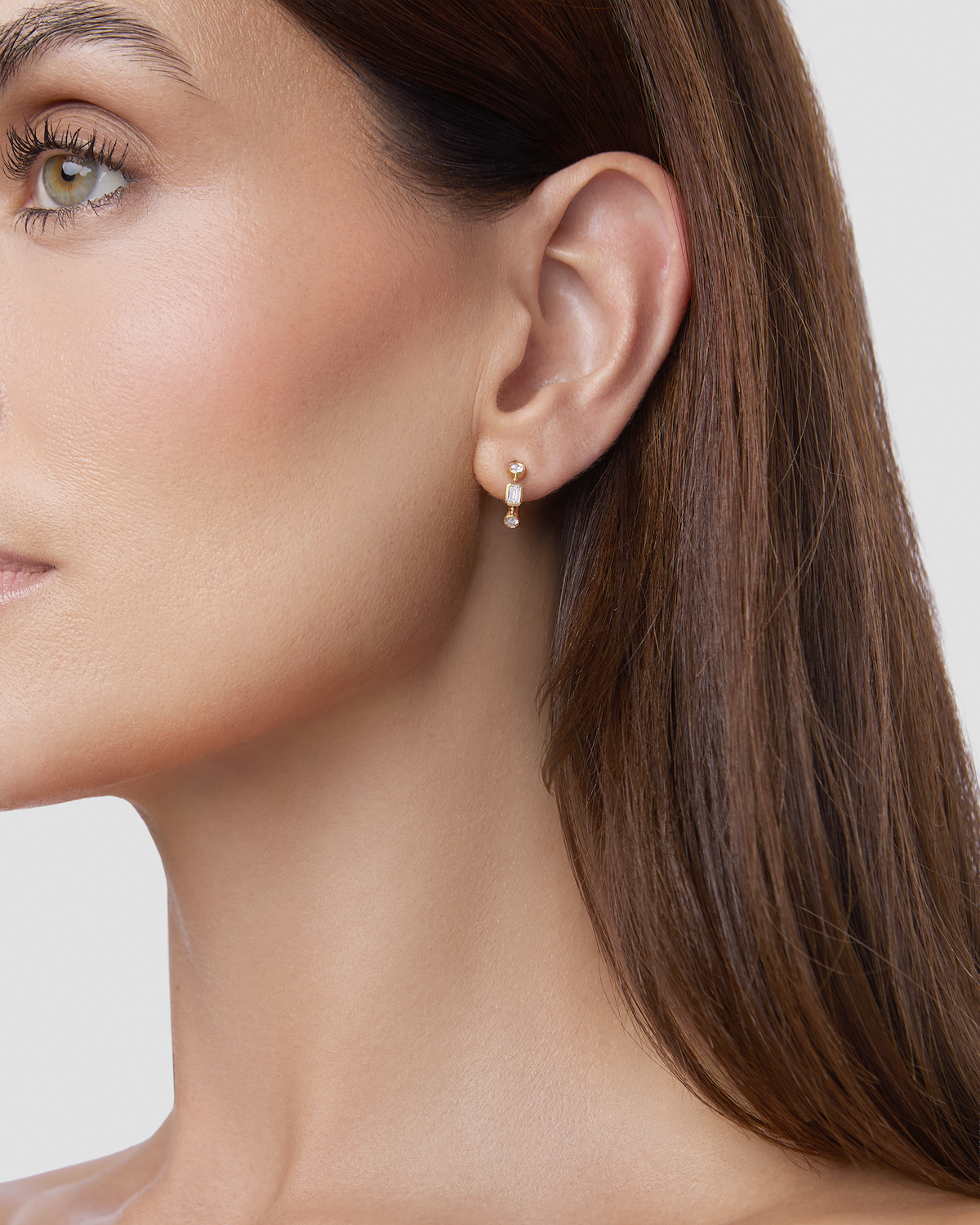 Essential Mixed Shape Diamond Bezel Huggie gold earring - close-up detail | diamond huggie earrings