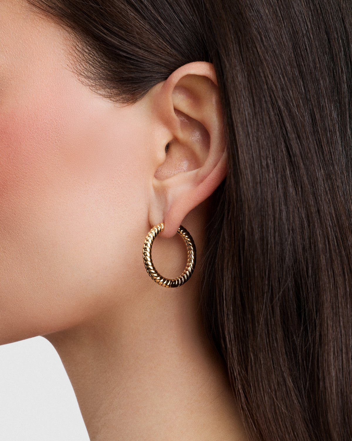 Madison Avenue Huggies gold earring - front view | hoop earrings