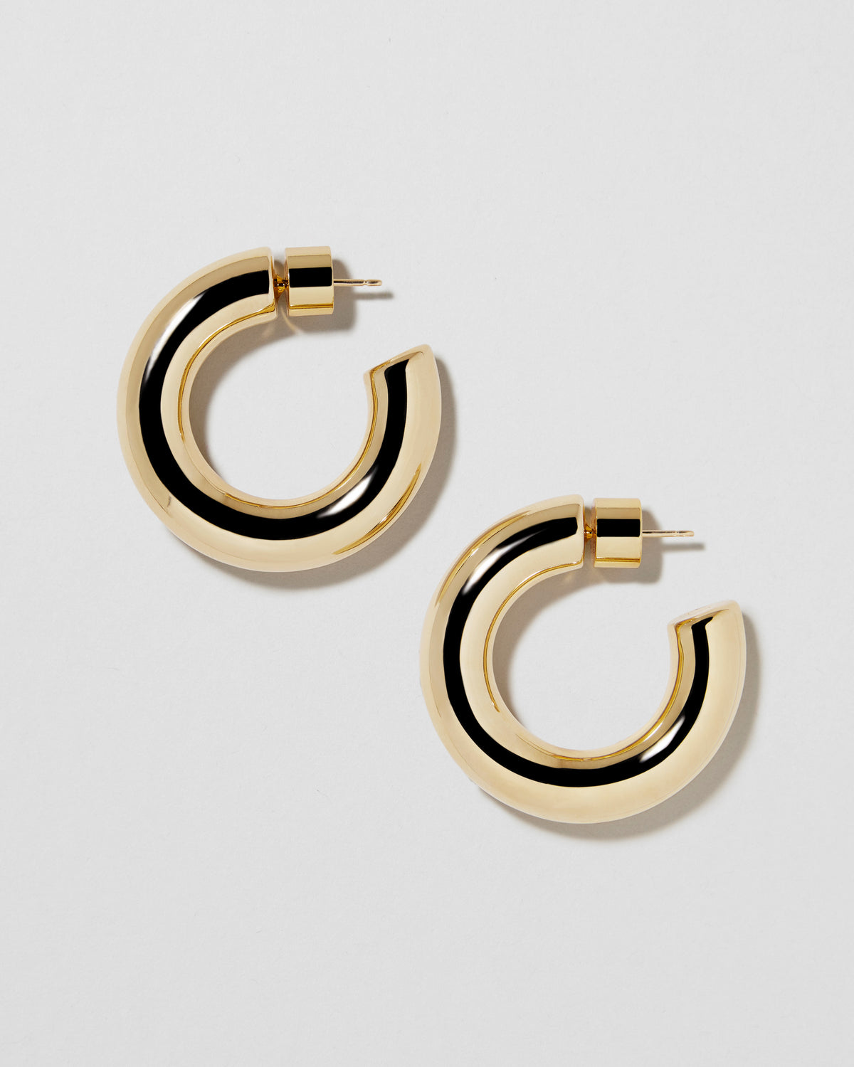 Jamma Huggies earring - alternate angle | gold huggie earrings