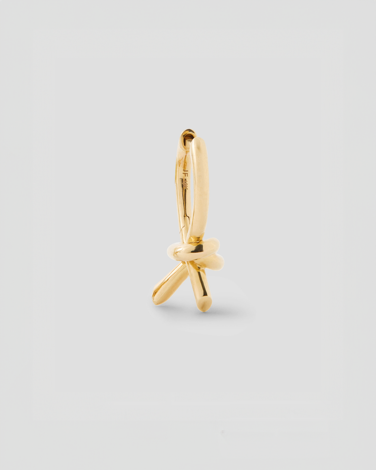 Knot Huggie earring - side view | gold huggie earrings