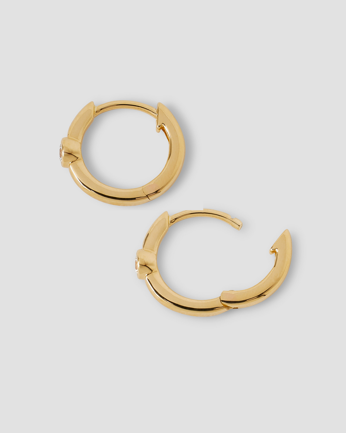 18K Essential Single Stone Tiny Huggie gold earring - alternate angle | diamond huggie earrings
