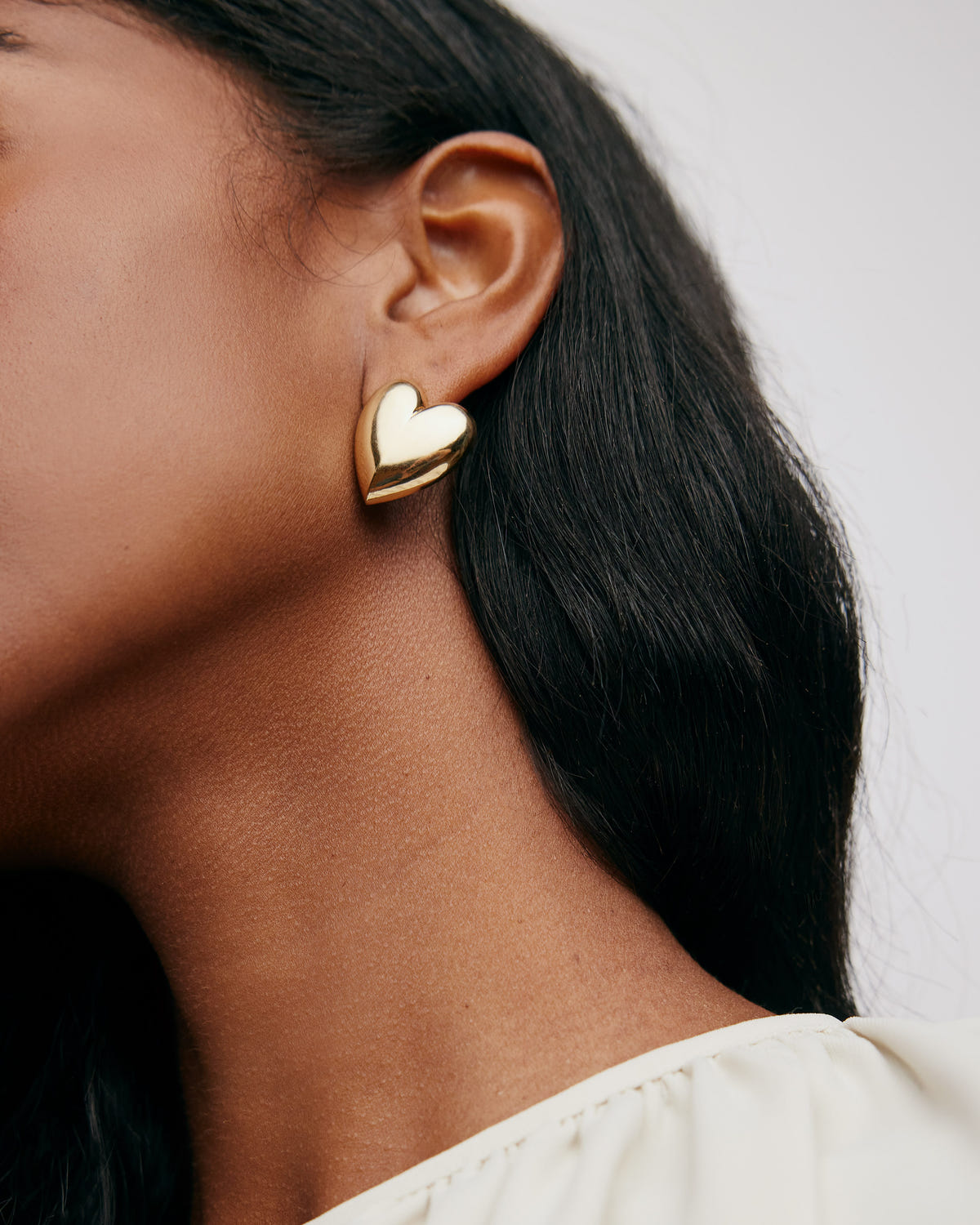 Small Puffy Heart Earrings earring - close-up detail | womens gold earrings