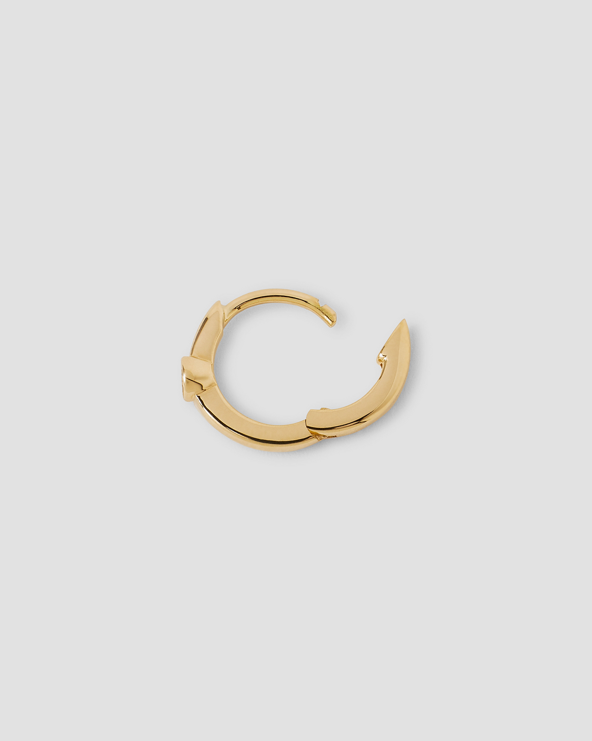 18K Essential Single Stone Tiny Huggie gold earring - close-up detail | diamond huggie earrings