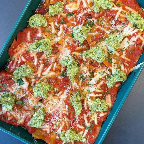 Sheet tray filled with gluten-free lasagne noodles, smothered in JF tomato sauce, vegan cheeses and pesto ricotta. Topped with a sprinkle of JF Spicy Salt. 