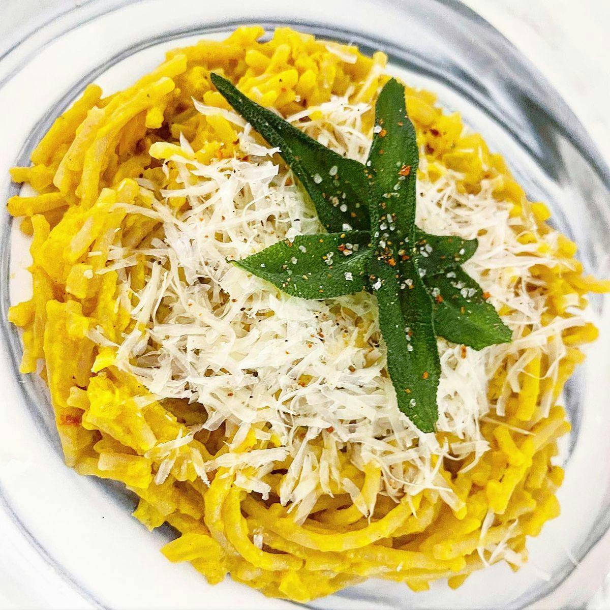 Pumpkin Pasta in a bowl with cheese and dried sage