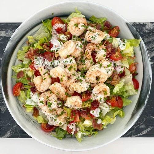 Romaine salad with tomatoes and shrimp topped with our delicious mayo-free ranch dressing