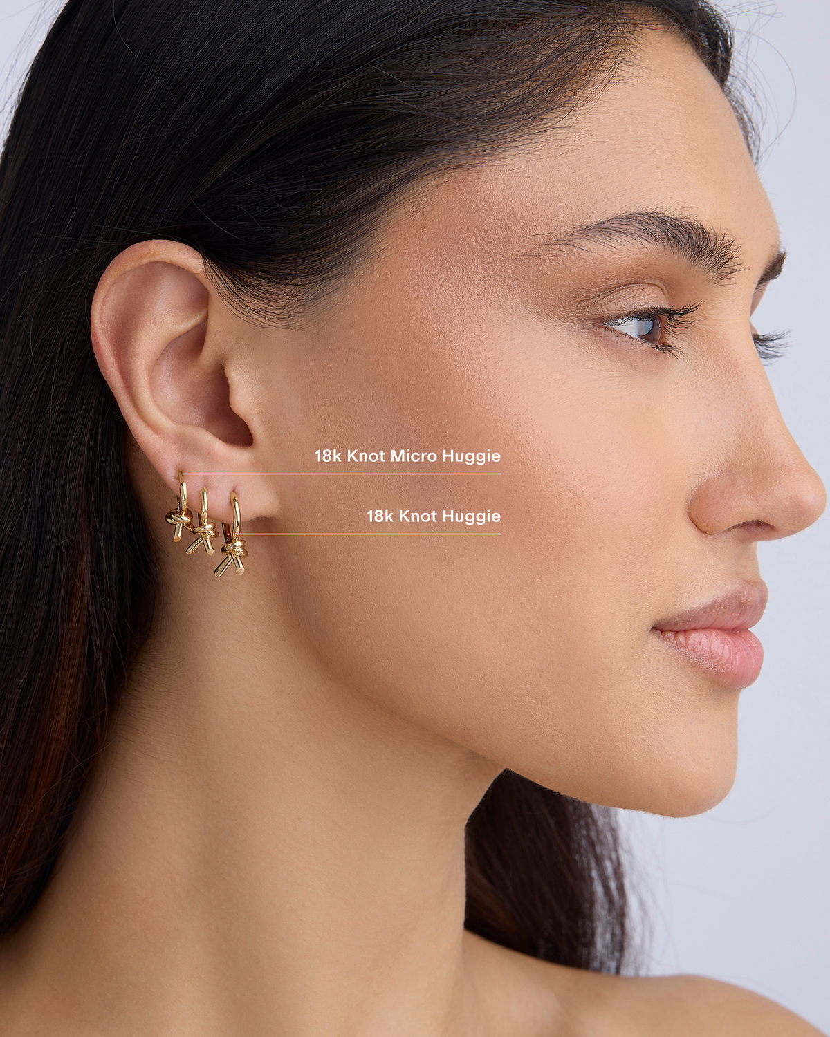 Knot Micro Huggie earring - alternate angle | gold huggie earrings