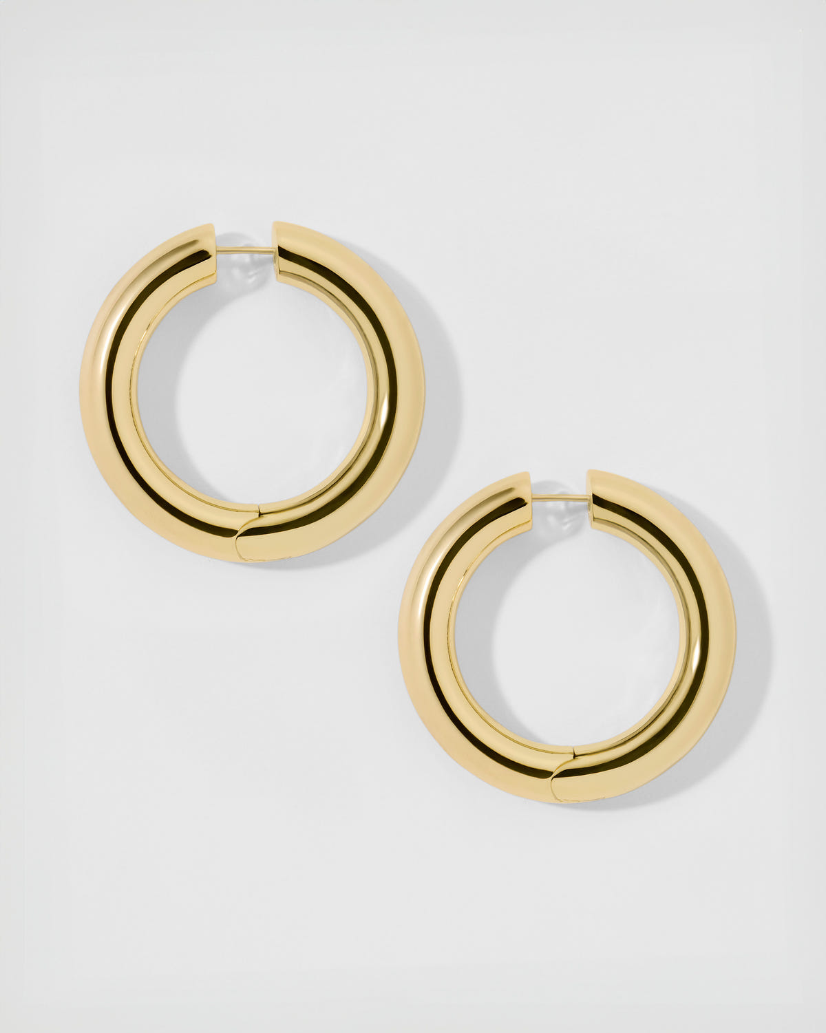1" Samira Hinged Mini Hoops earring - close-up detail | gold small hoop earrings