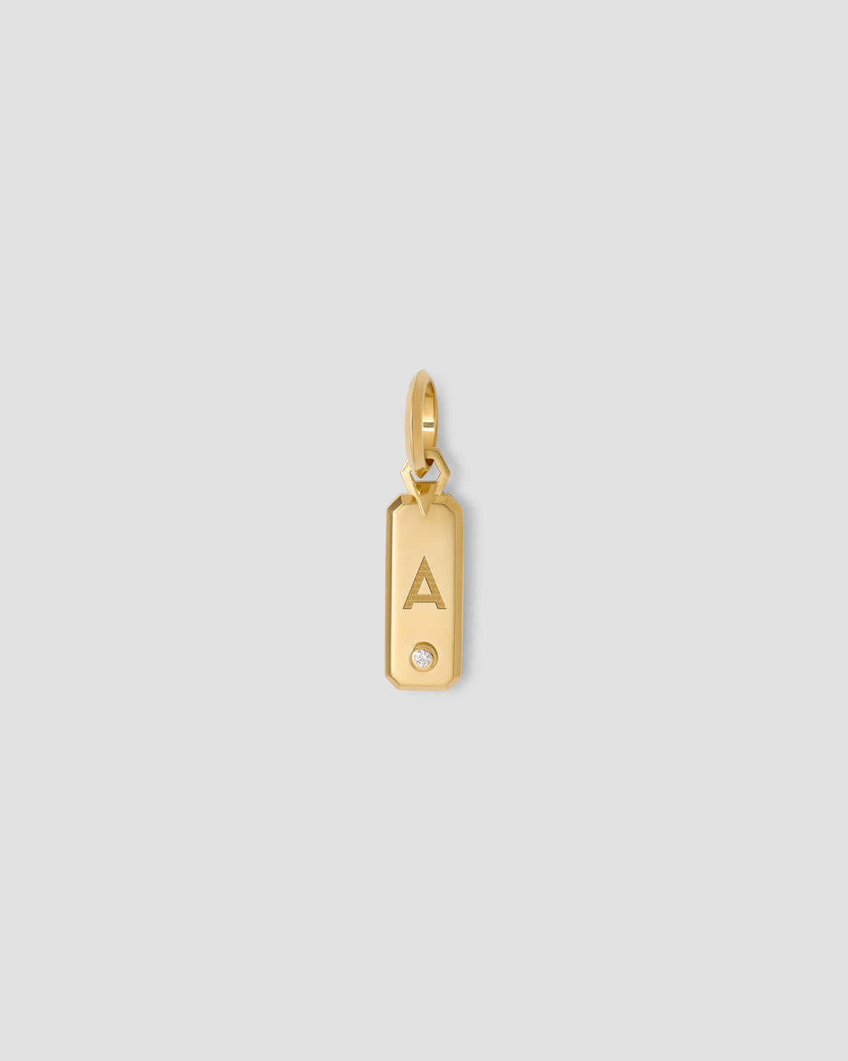 Minimal Block Letter Dog Tag in 18K Yellow gold charm - alternate angle | necklace with charms