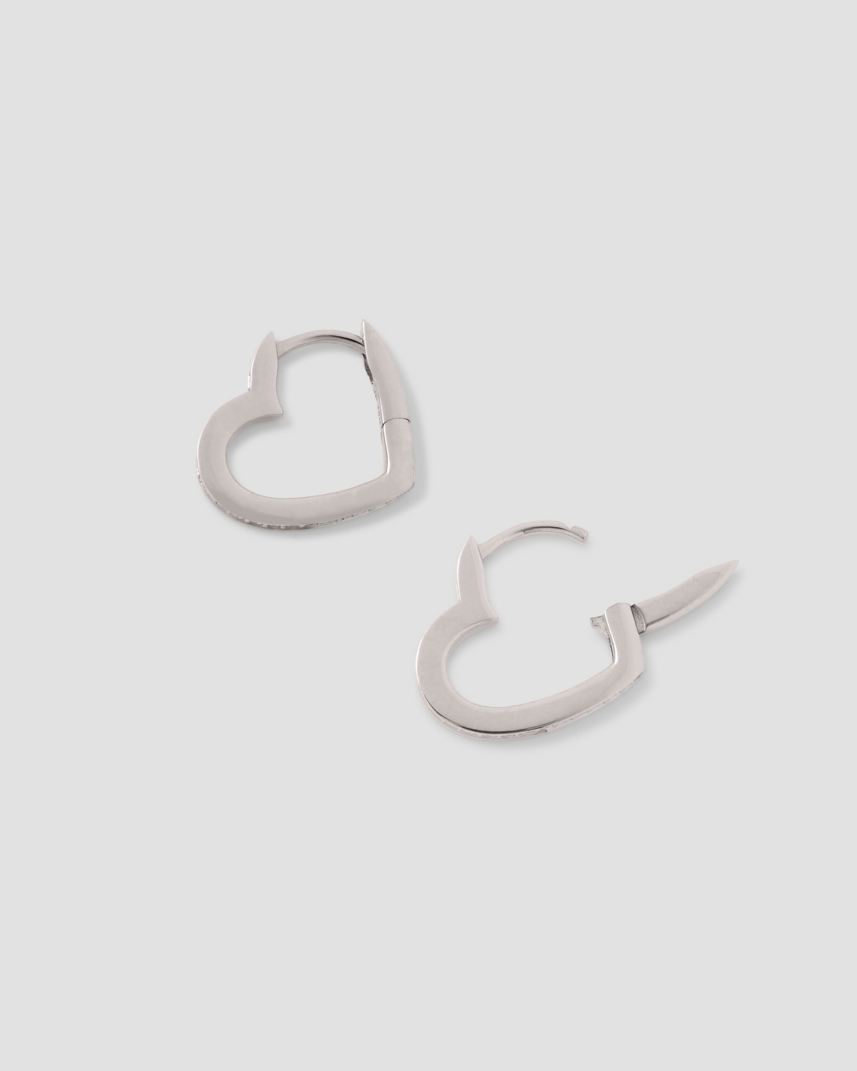 18k Small Heart Huggie With Pavé White Diamonds gold earring - front view | diamond huggie earrings
