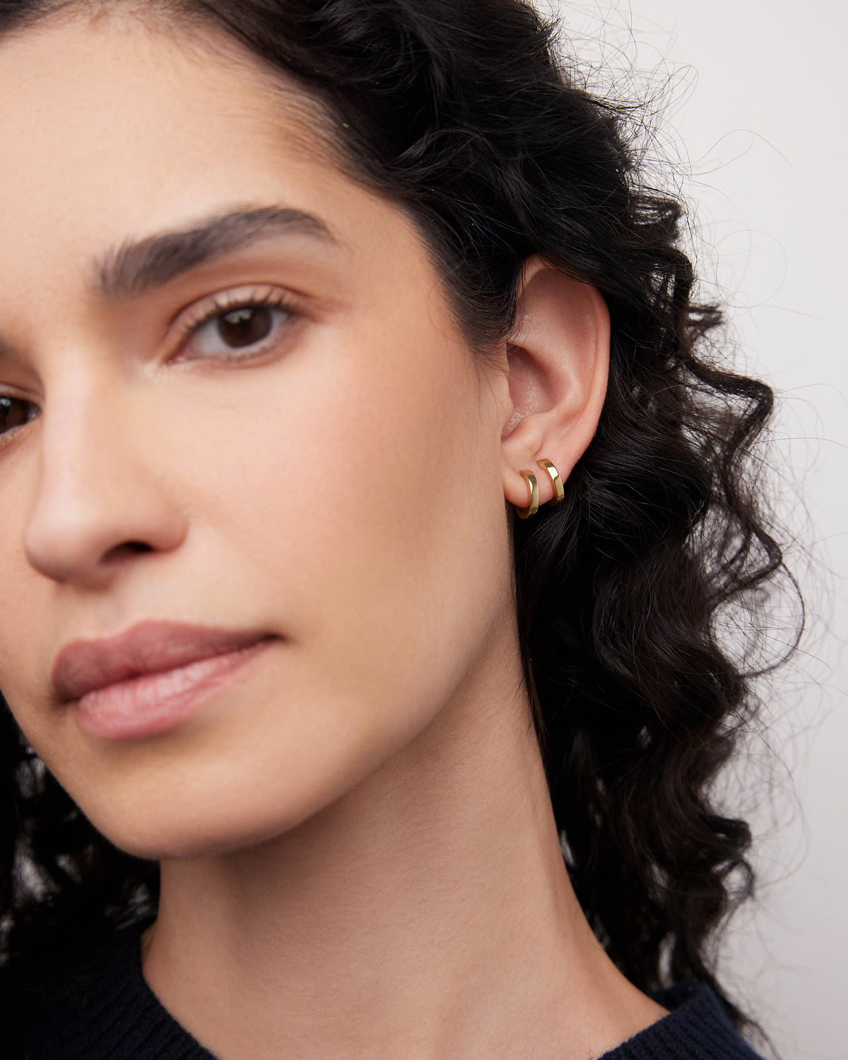 18k Extra Small Huggie earring - side view | gold huggie earrings