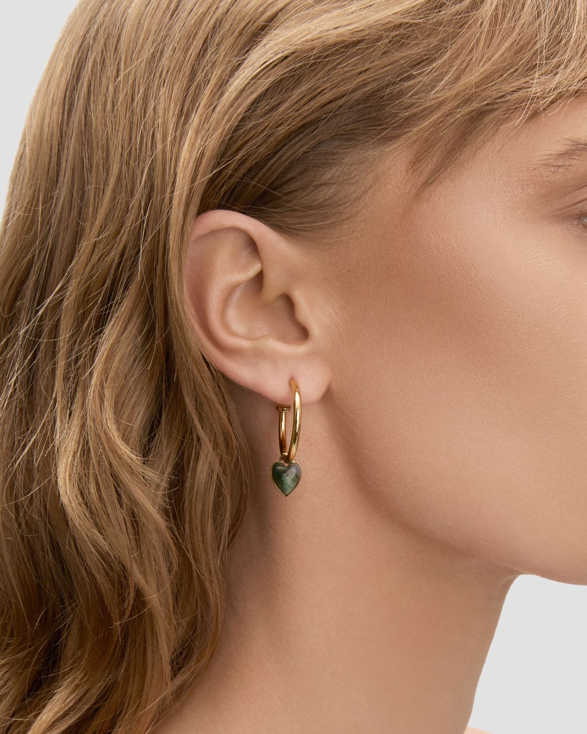 Semi-Precious Convertible Heart Huggies earring - close-up detail | gold huggie earrings