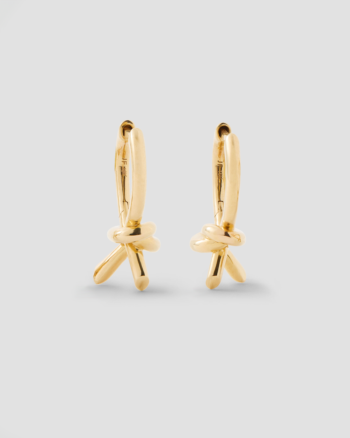 Knot Huggie earring - front view | gold huggie earrings