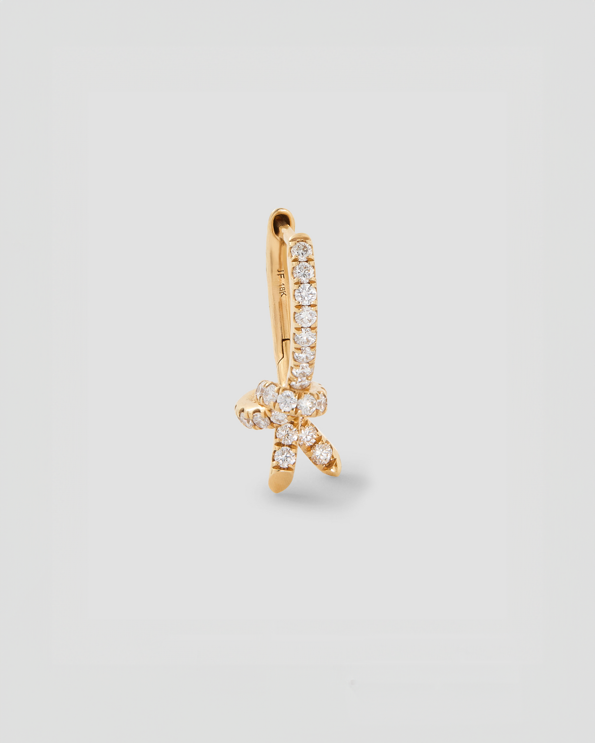 Knot Huggie with Pavé White Diamonds gold earring - alternate angle | diamond huggie earrings