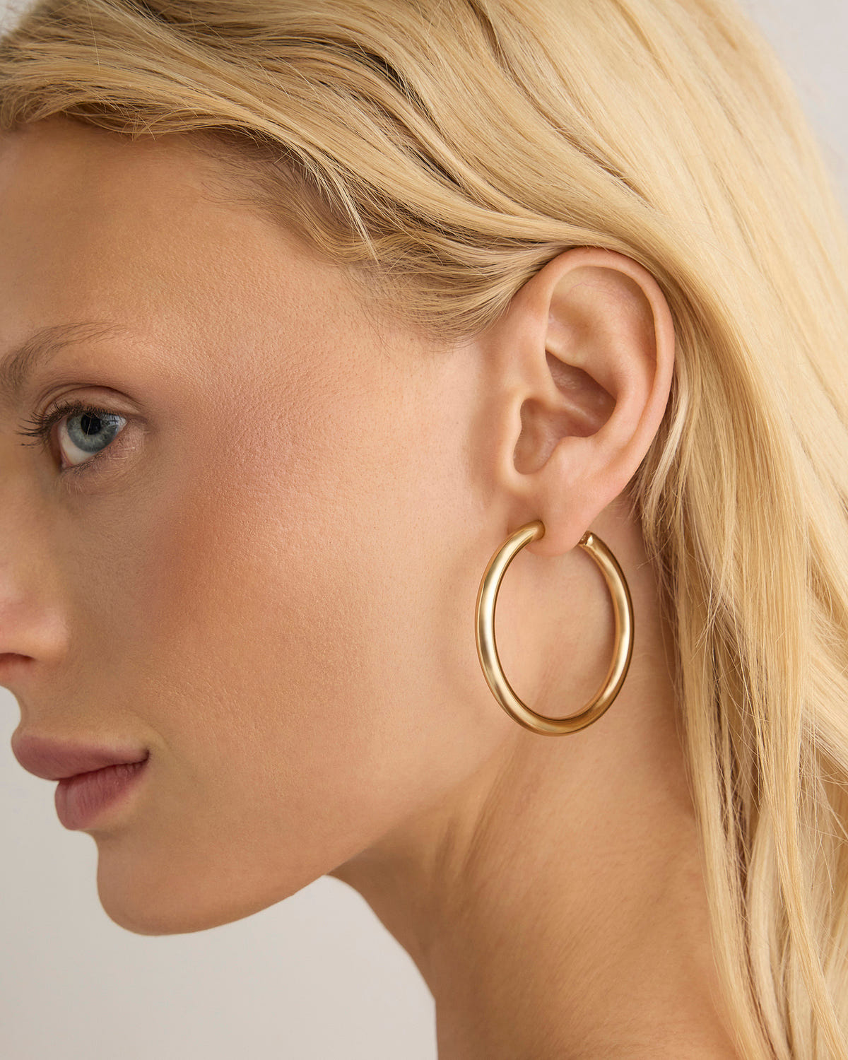 1.5" Natasha Baby Hoops earring - close-up detail | gold hoop earrings