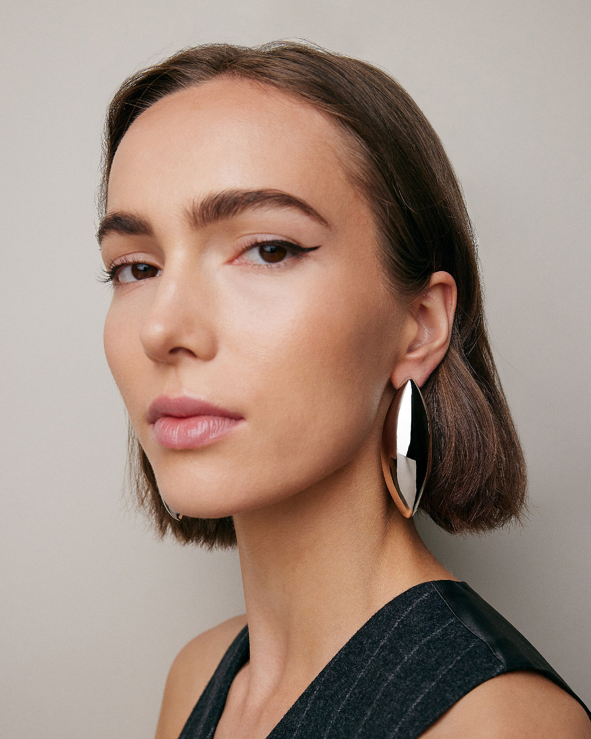 Puffy Dagger Earrings - alternate angle | gold earrings