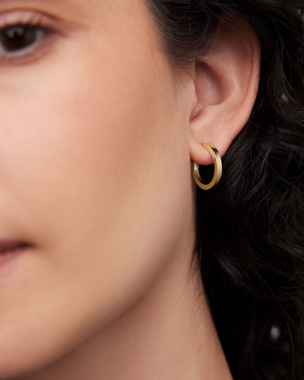 18k Huggie earring - styled on model | gold huggie earrings