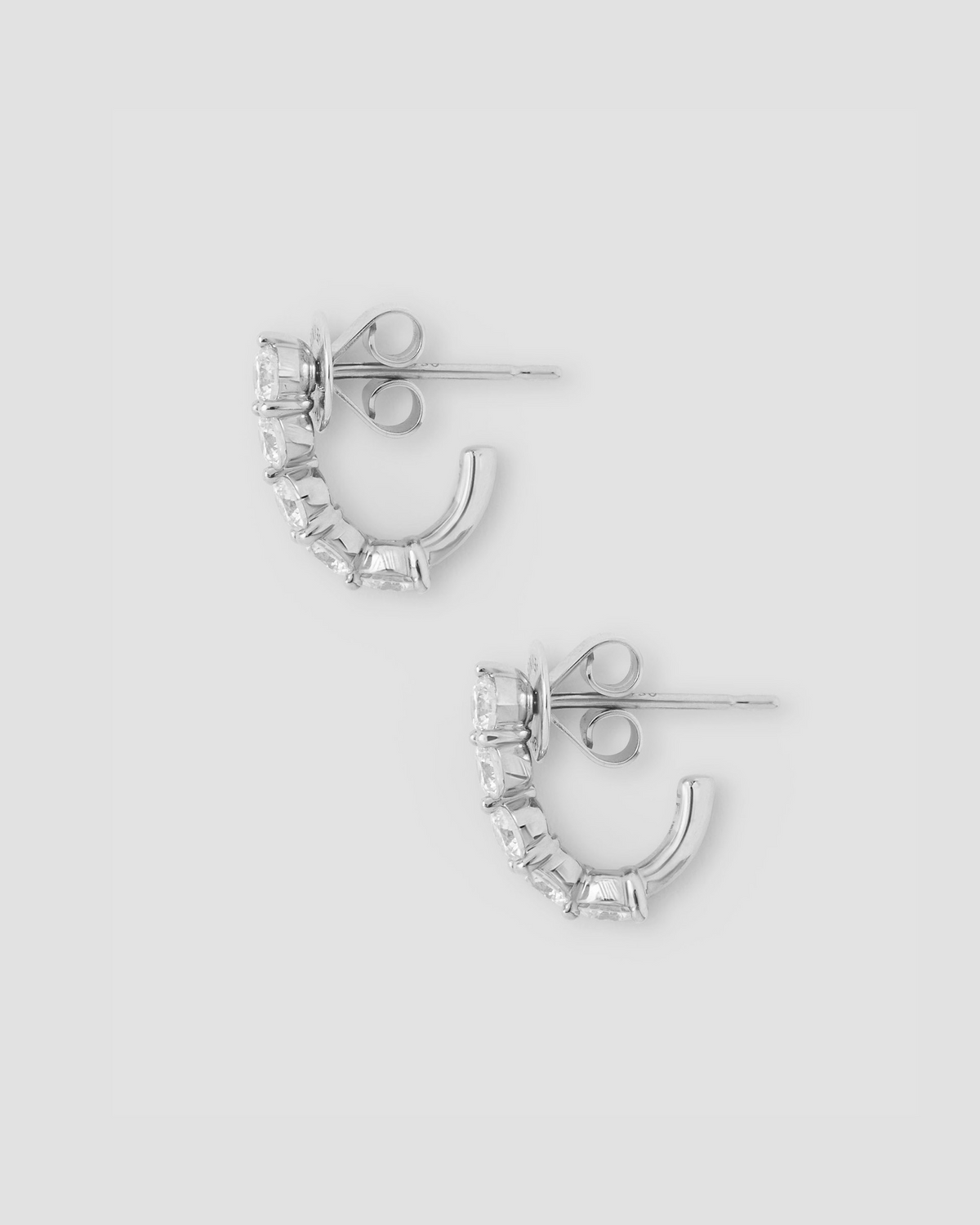 Floating Five Diamond Huggies 18K gold earring - worn look | diamond huggie earrings
