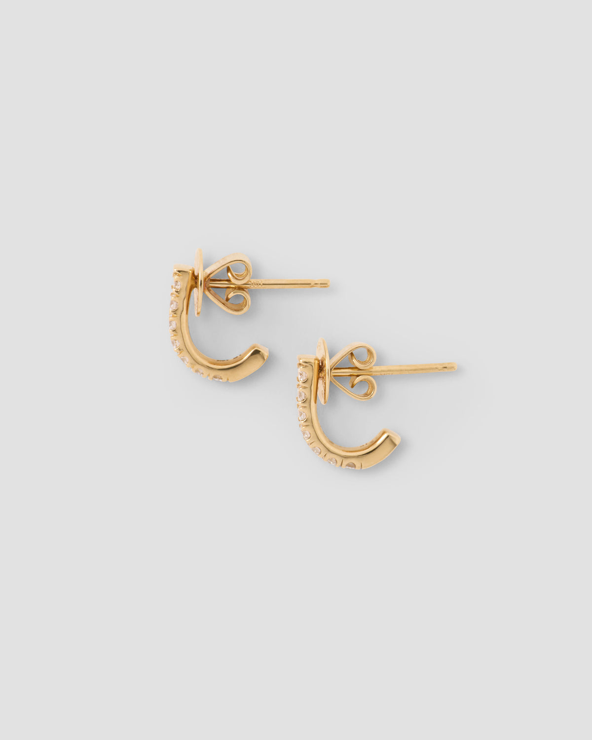 Micro Pavé Diamond Level Huggie in 18K Yellow Gold earring - styled on model | diamond huggie earrings