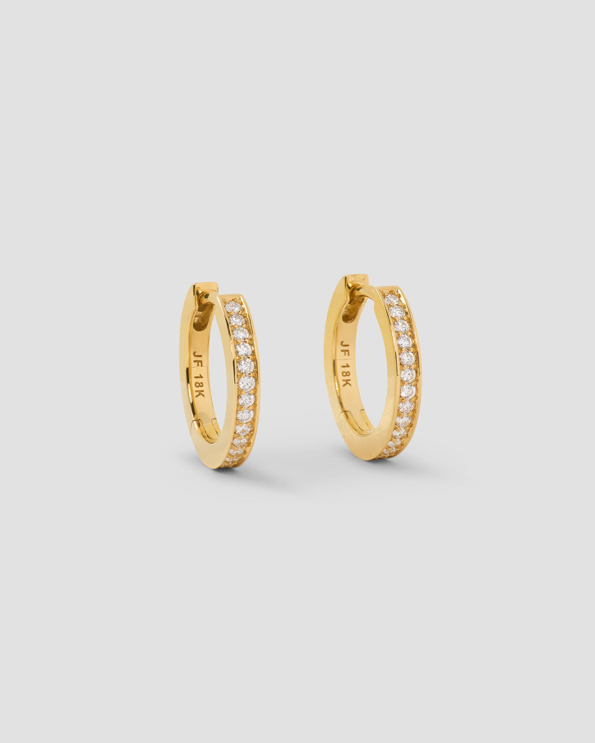 18k Small Huggie with Pavé Diamonds 18K gold earring - front view | diamond huggie earrings