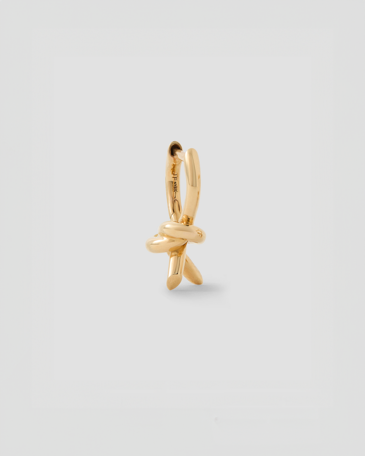 Knot Micro Huggie earring - side view | gold huggie earrings