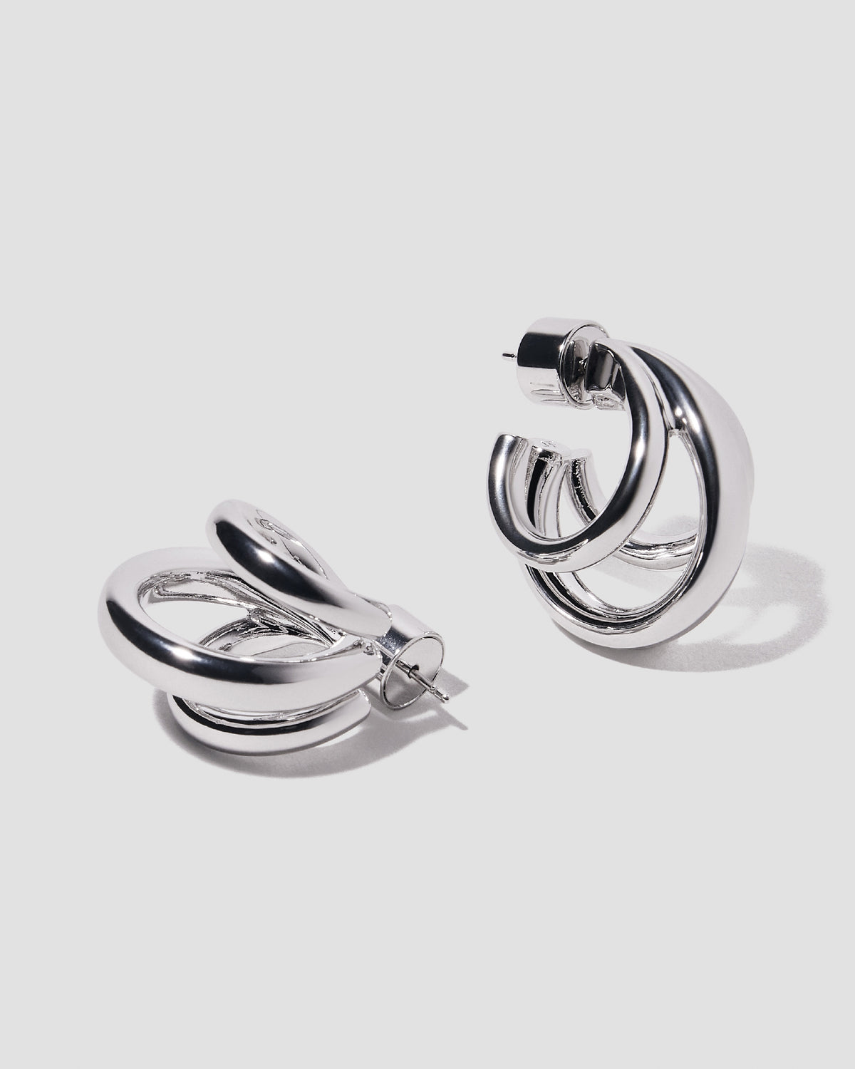Triple Lilly Huggies earring - product detail shot | gold huggie earrings