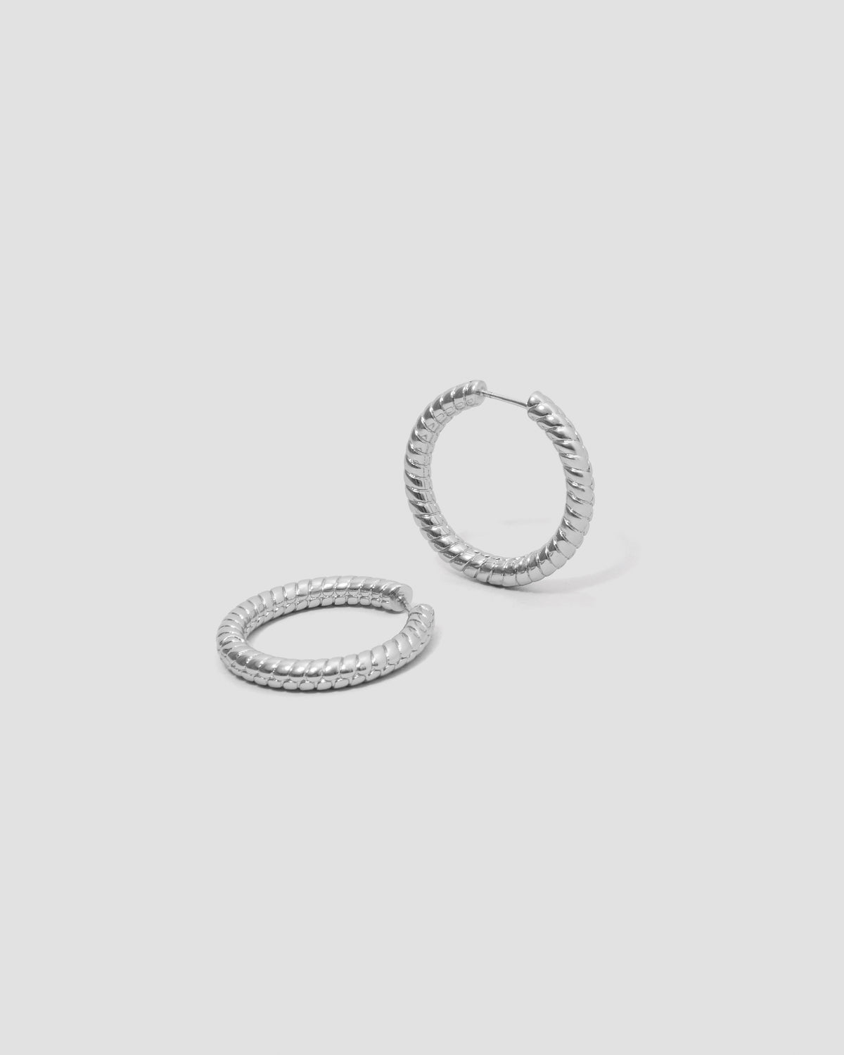 Madison Avenue Huggies gold earring - close-up detail | hoop earrings