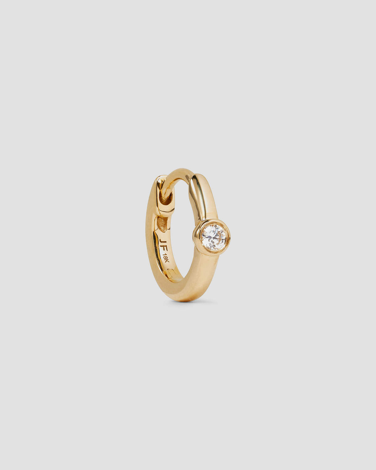 18K Essential Single Stone Tiny Huggie gold earring - front view | diamond huggie earrings