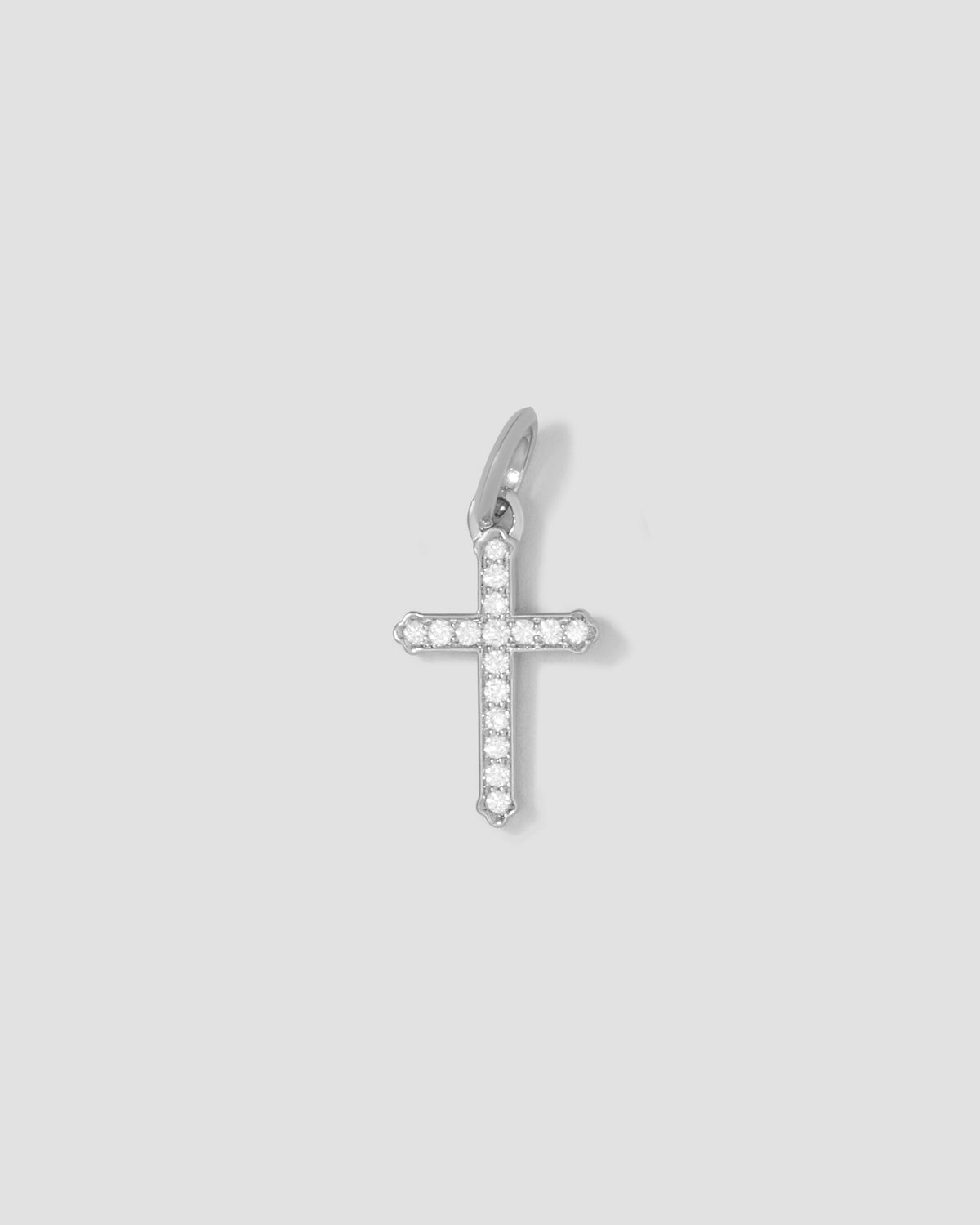 Small Royal Cross with Pavé White Diamonds gold charm - styled on model | diamond cross pendant