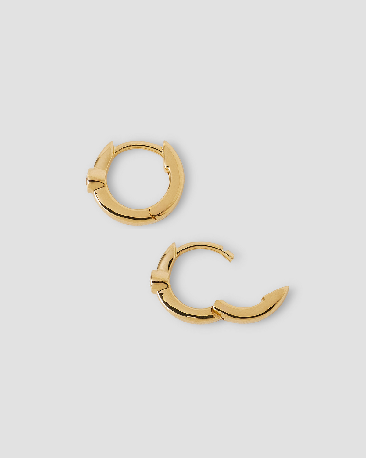 18K Essential Single Stone Tiny Huggie gold earring - alternate angle | diamond huggie earrings
