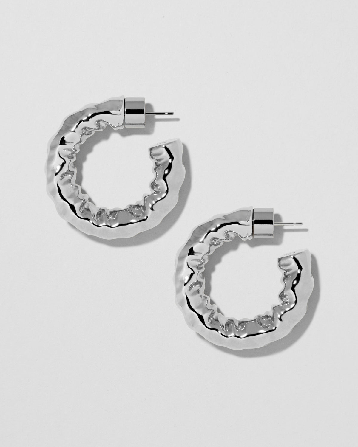 Maeve Huggies earring - styled on model | gold huggie earrings